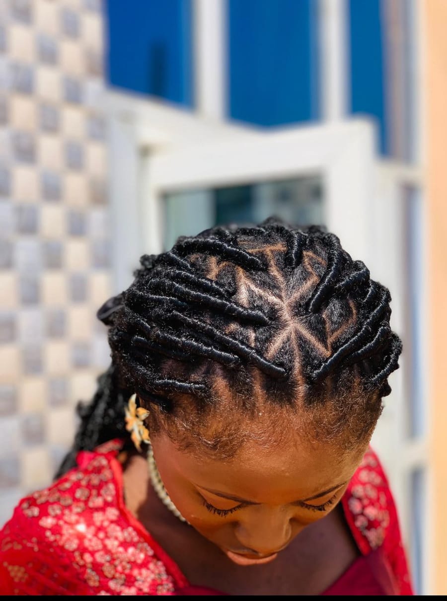 Flat twists laid in a starburst parting across the crown