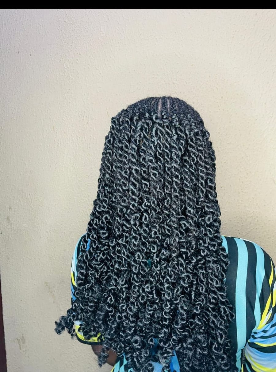 Shoulder-length passion twists with a defined curl pattern
